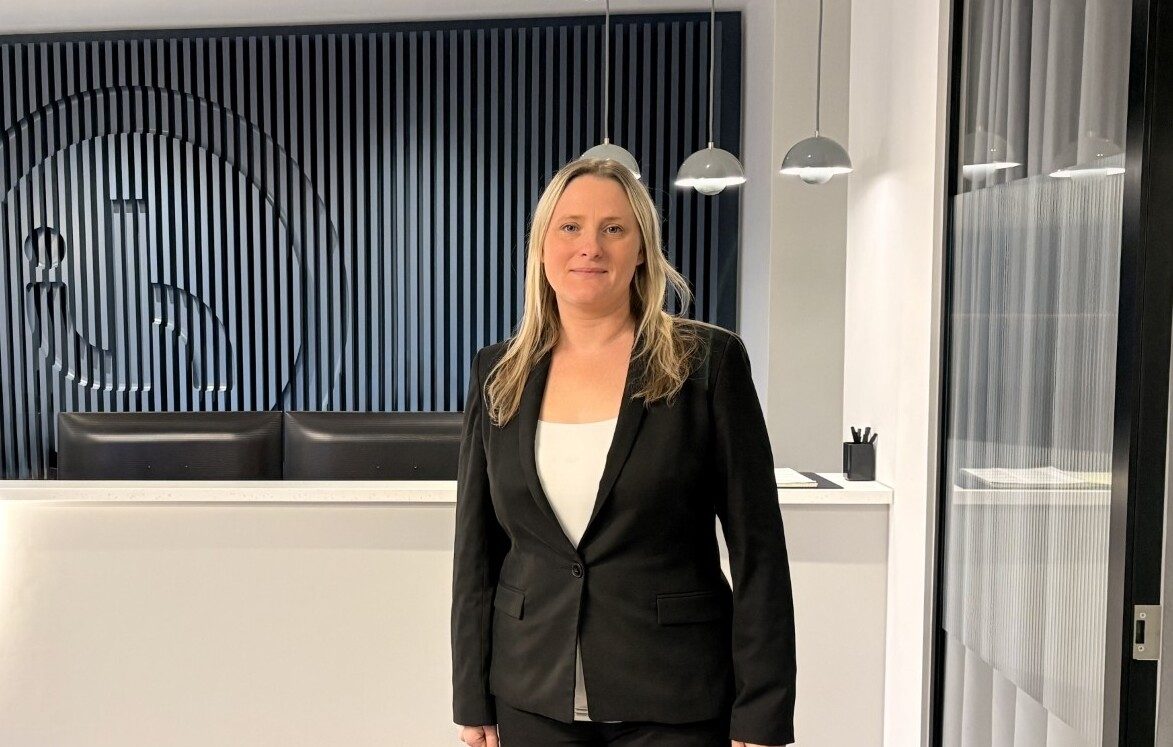 Gemma Vine, partner at Ison Harrison, standing in an office reception