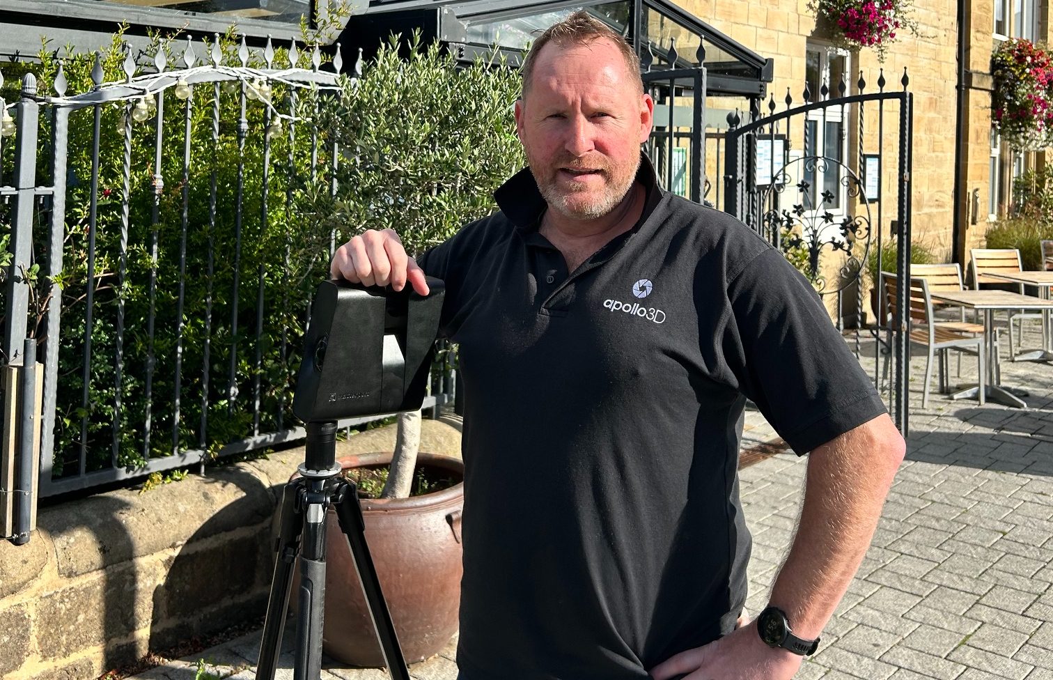 Mark Shepherd, founder and managing director of Apollo3D, standing beside a 3D scanner on a tripod